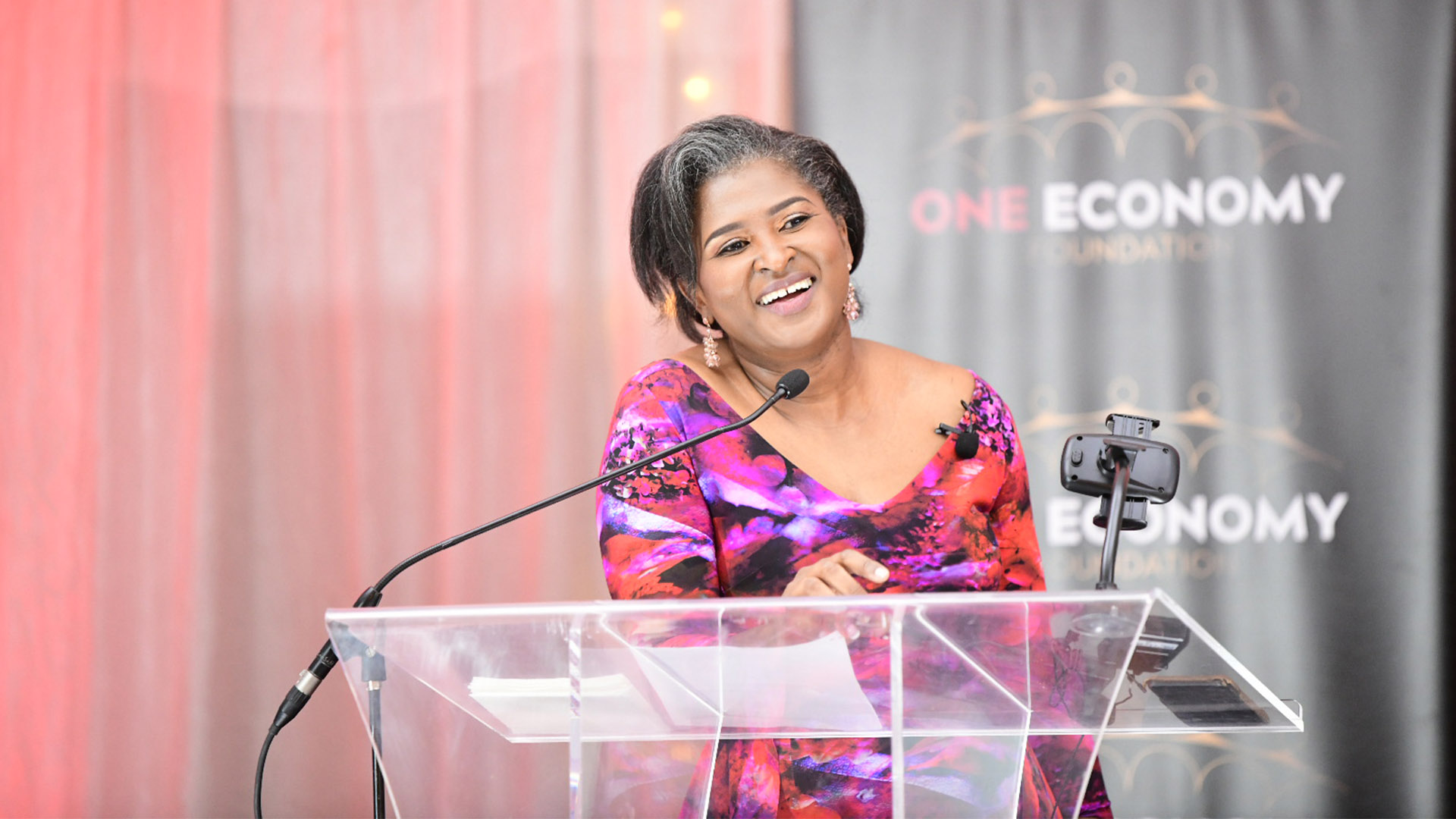 Monica Geingos speaking at a One Economy Foundation event - December 2023